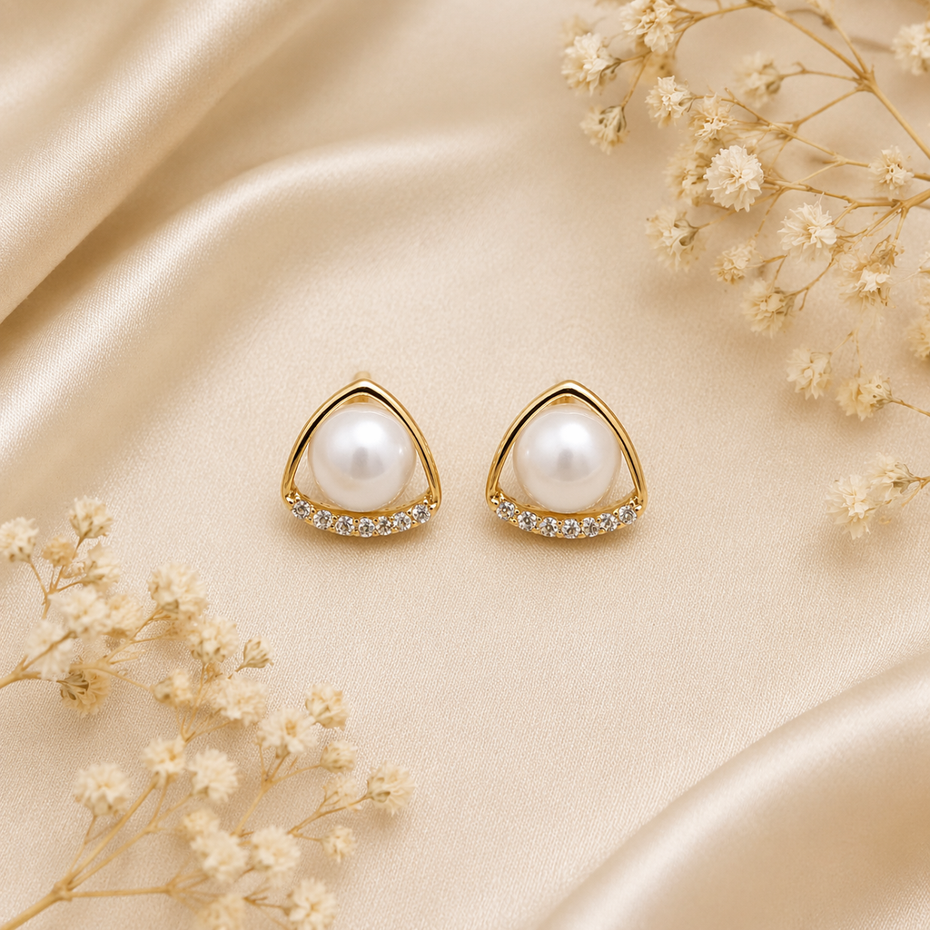 pearl centerpiece gold stud earrings on satin