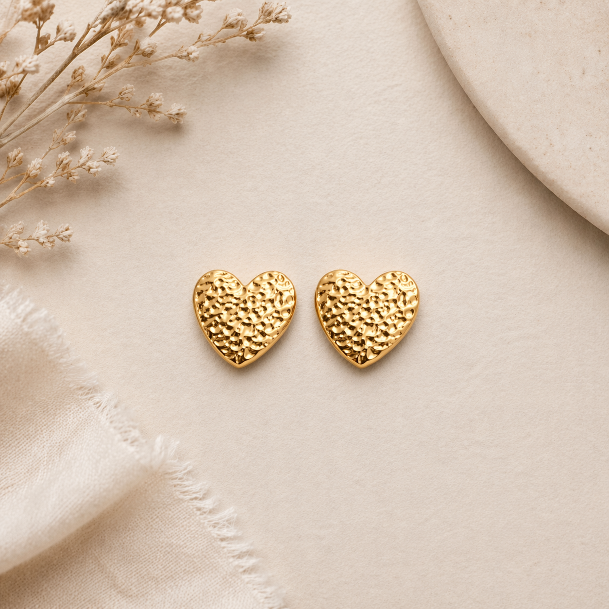  Textured heart shaped stud on marble