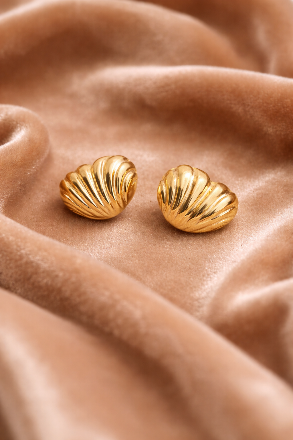 Subtle gold stud earringS on Velvet