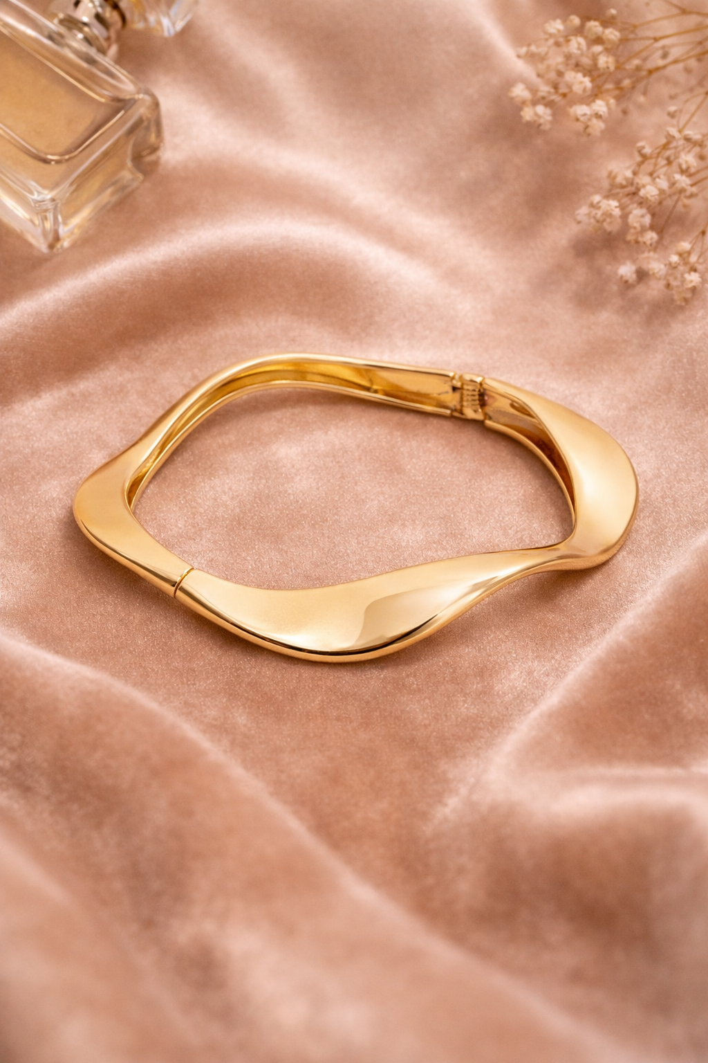 Sleek gold bangle on velvet