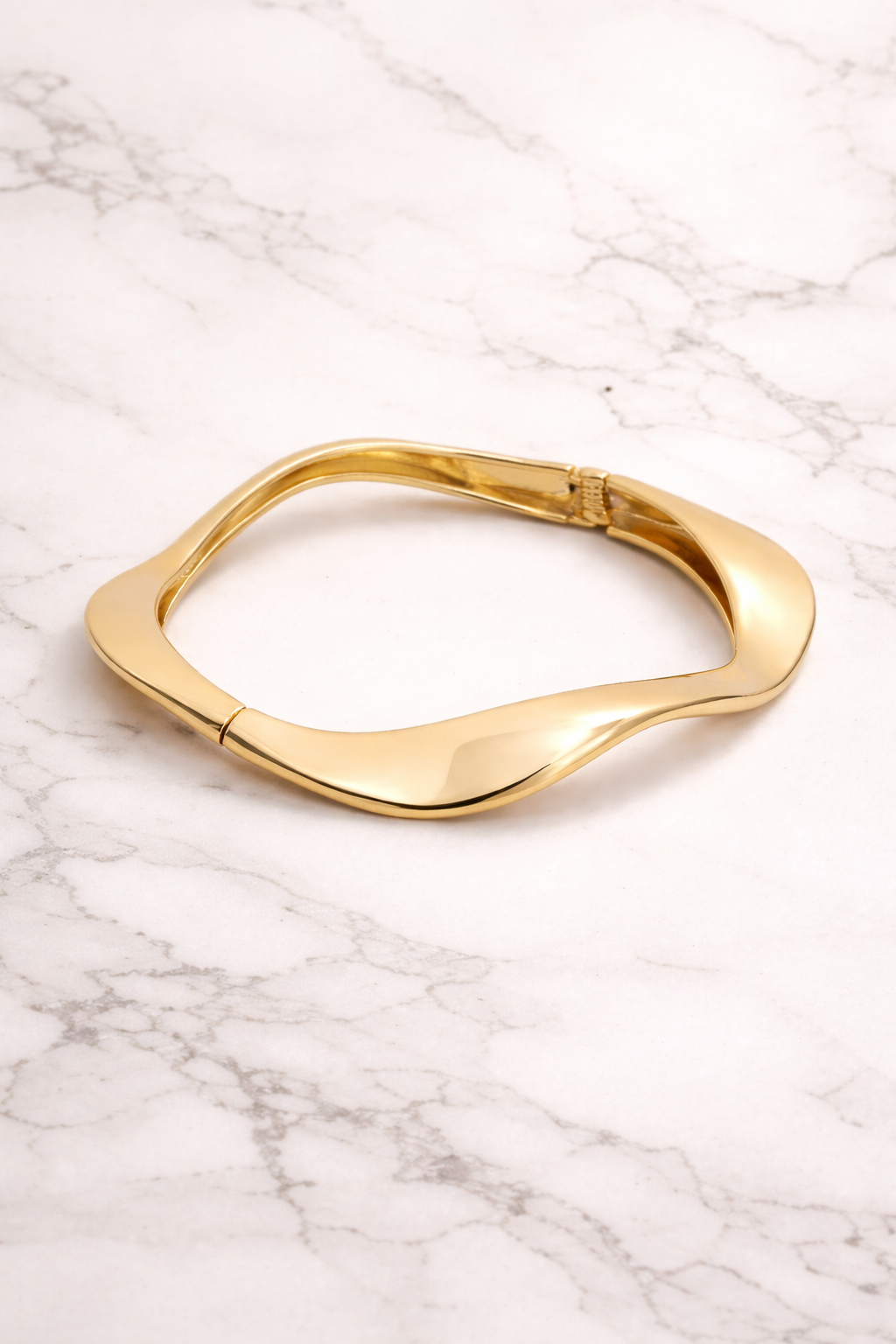 Sleek gold bangle on marle