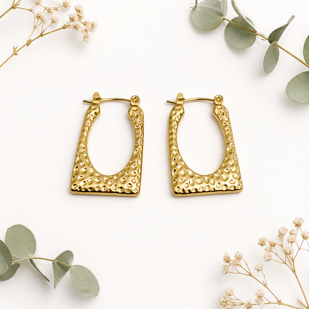 Square gold hoops on marble