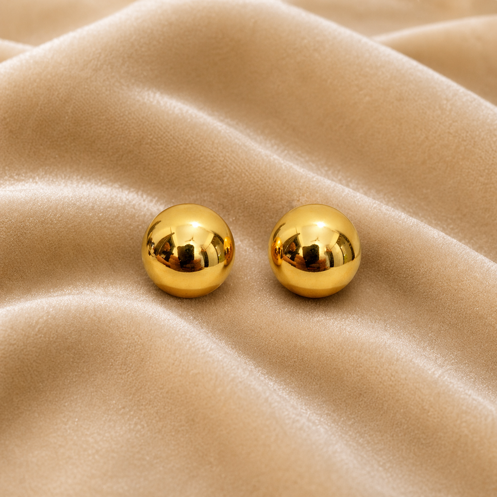 Ball stud earrings on velvet