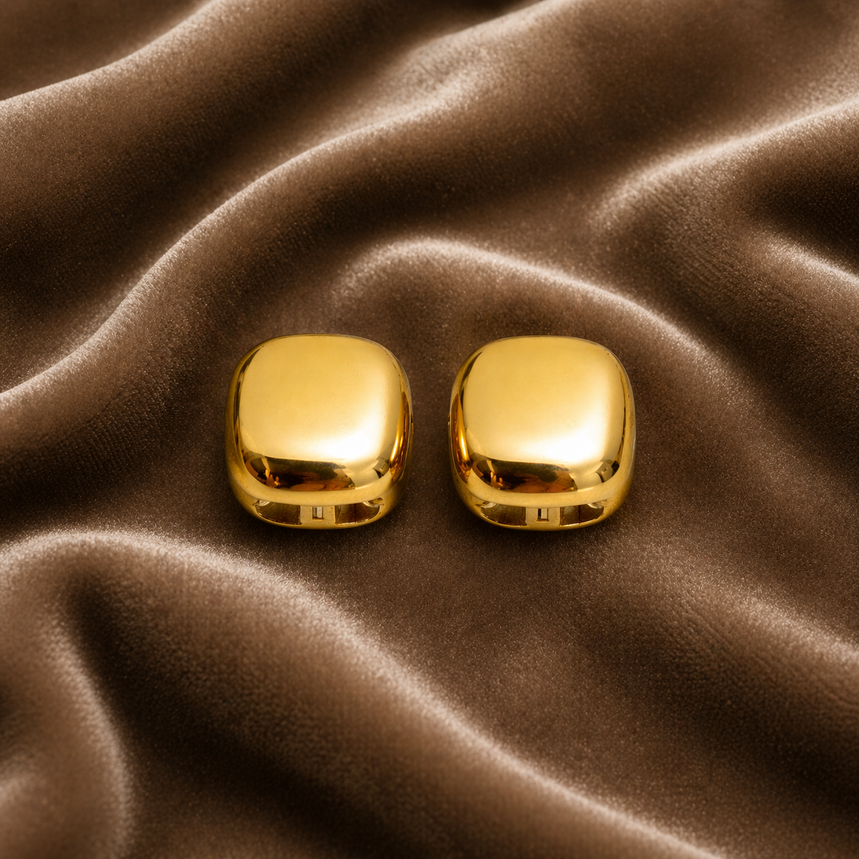 Square stud earrings on velvet