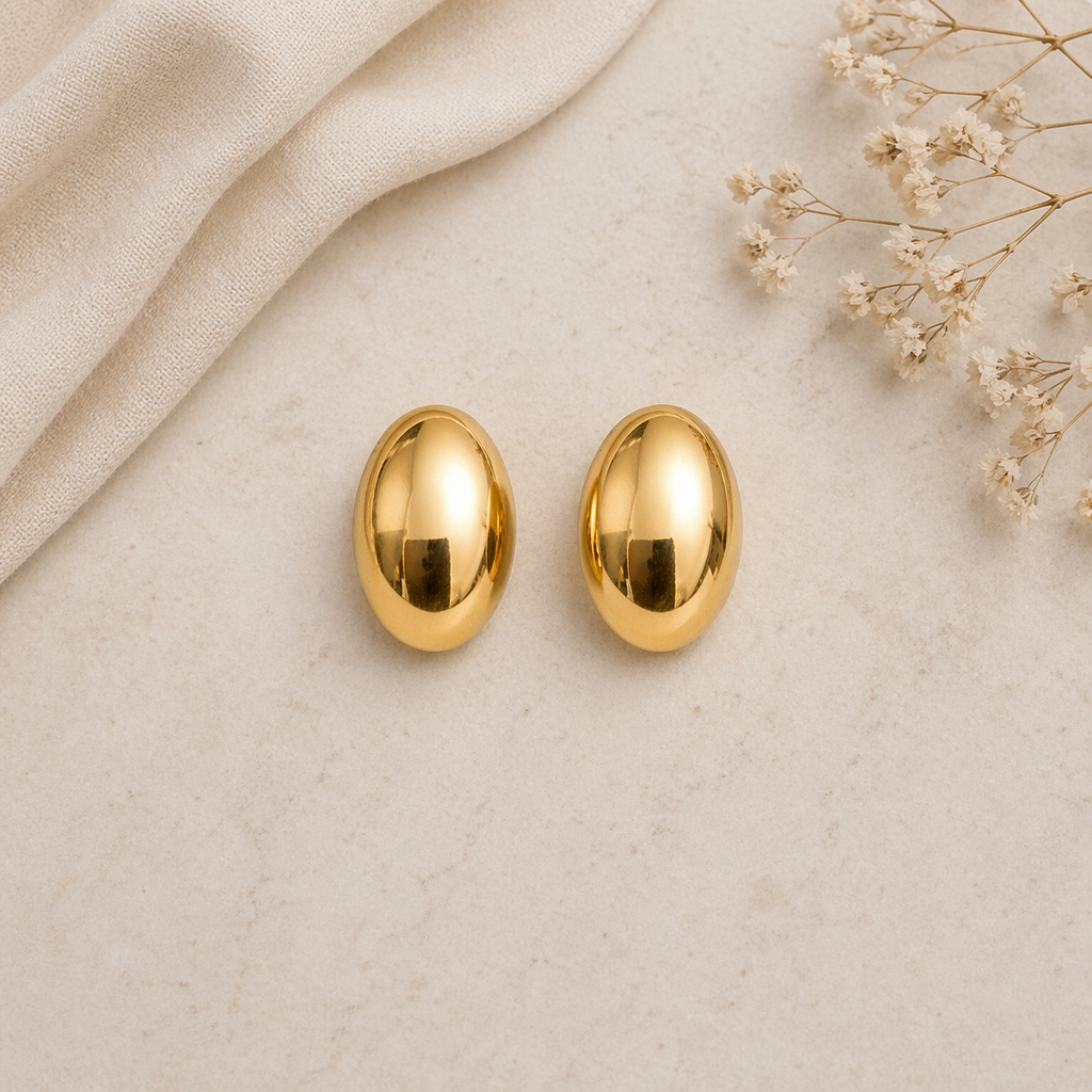 Oval stud earrings on marble