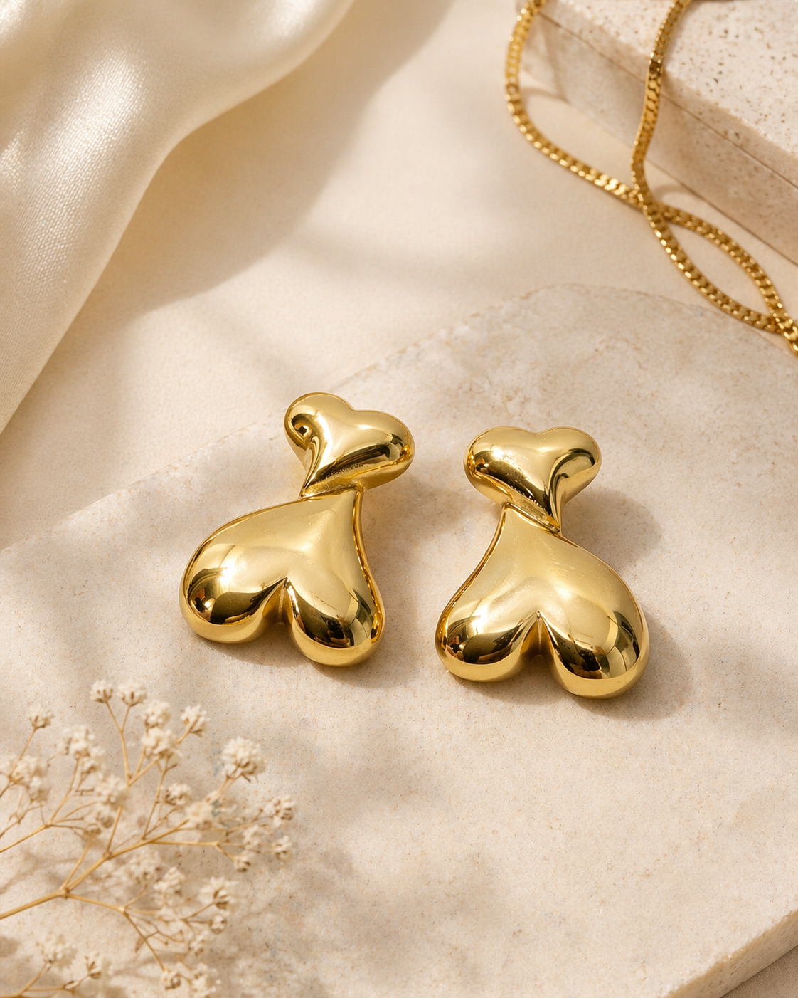 Heart drop earrings on marble 