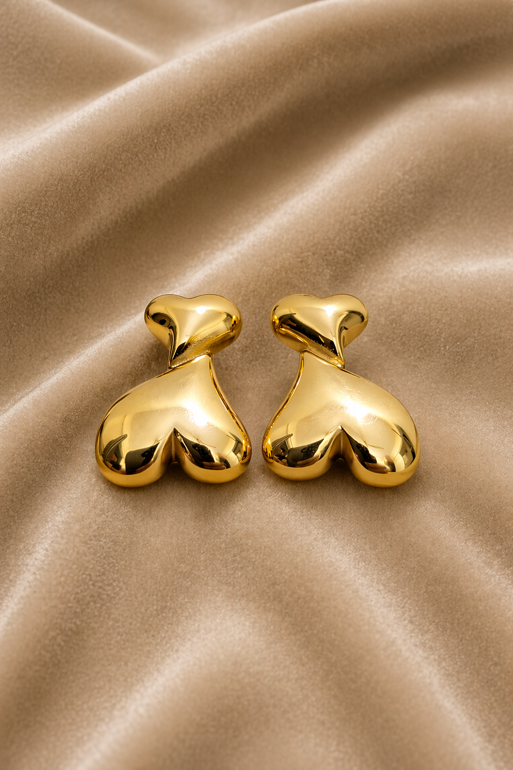 Heart drop earrings on velvet