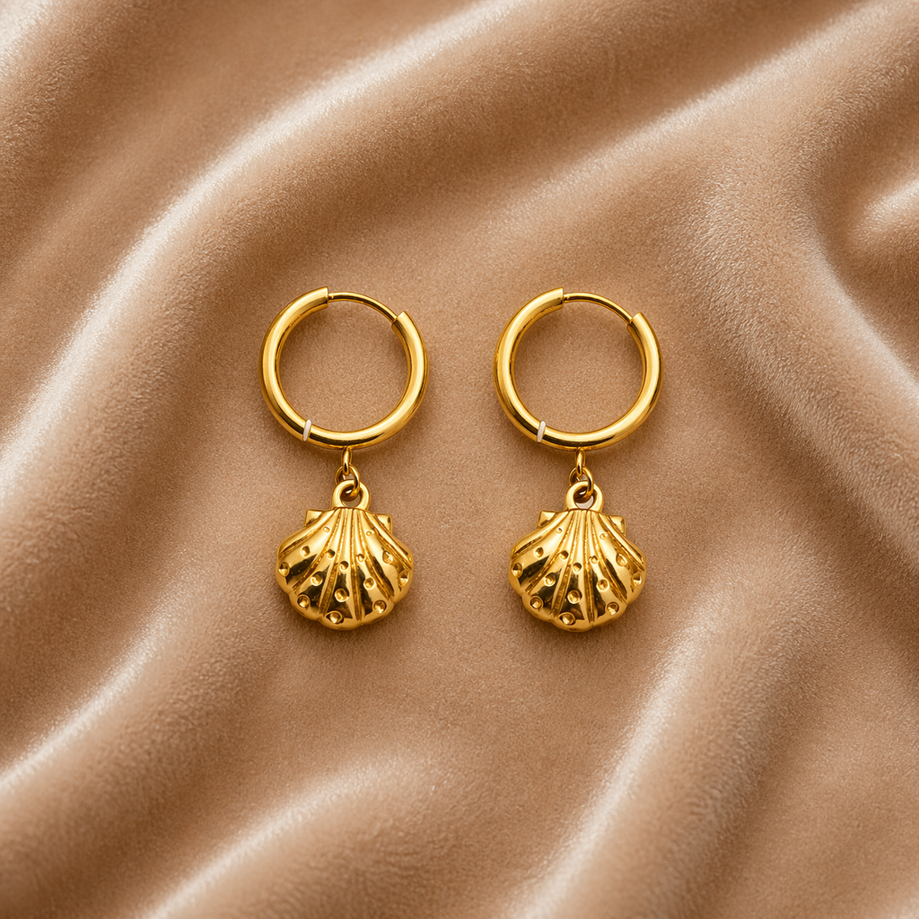Shell charm hoop earrings on velvet