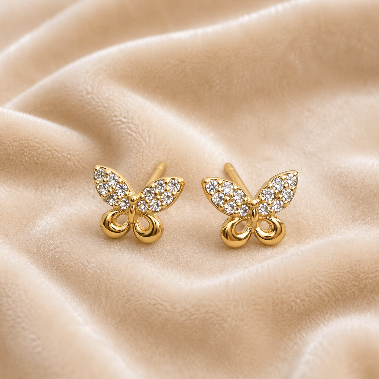Butterfly stud earrings on velvet