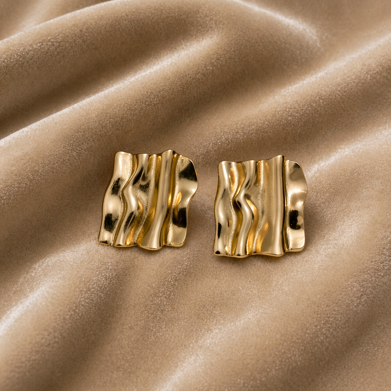 Fluid wave design earrings  on velvet
