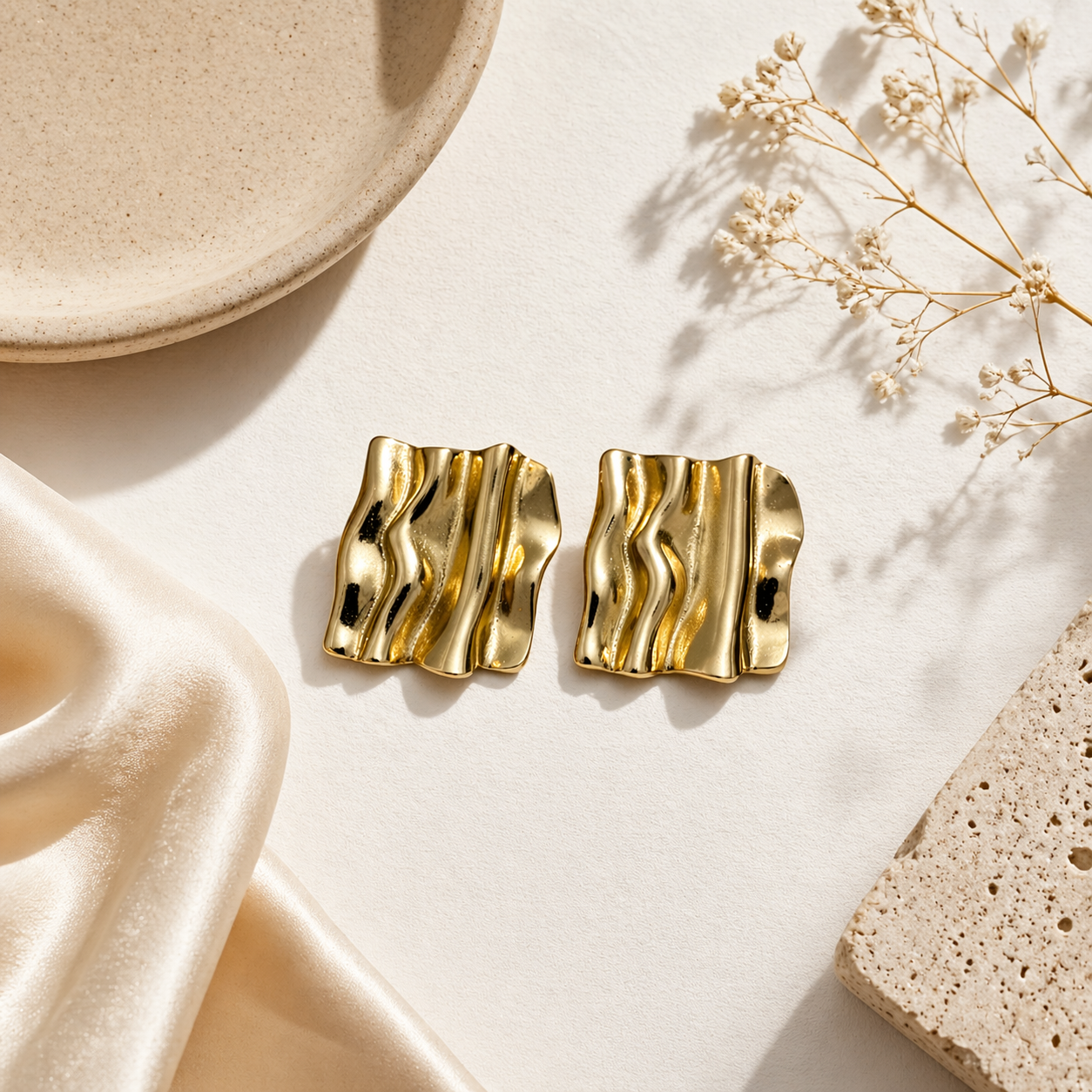 Fluid wave design earrings on marble