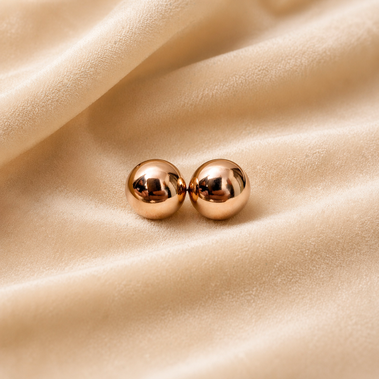 Ball stud earrings on velvet