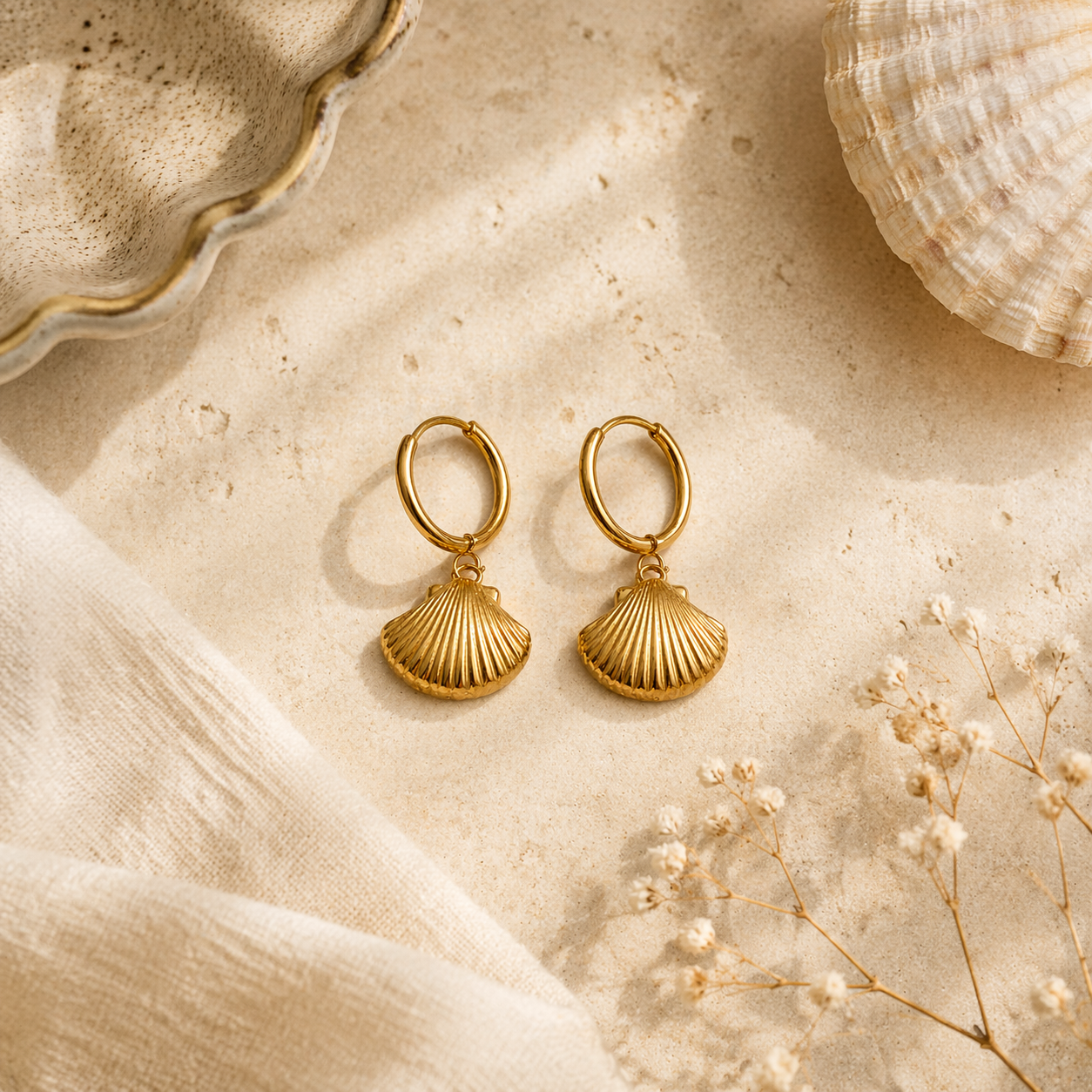 sea shell earrings on marble