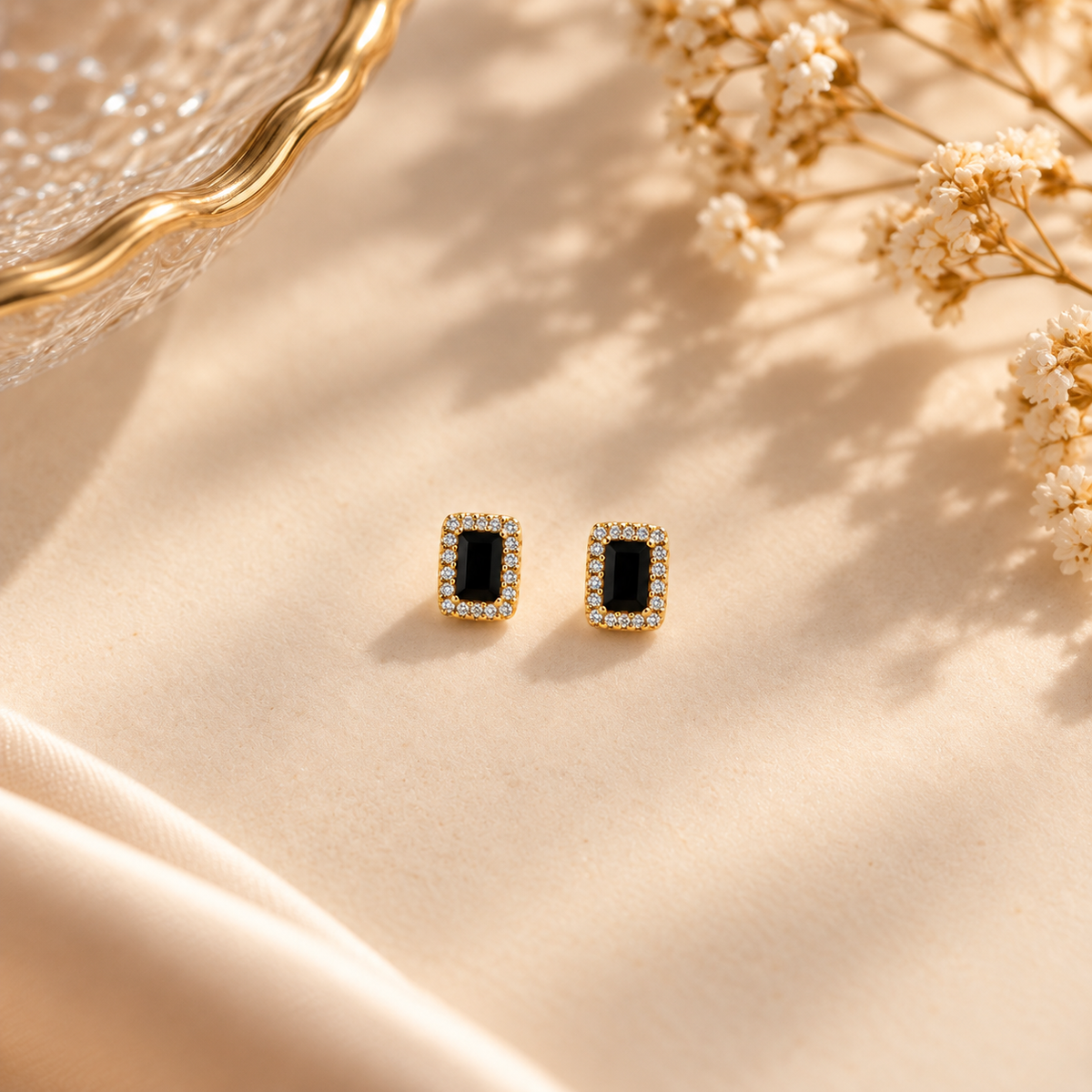 Gold & Black Halo Stud Earrings on flat lay