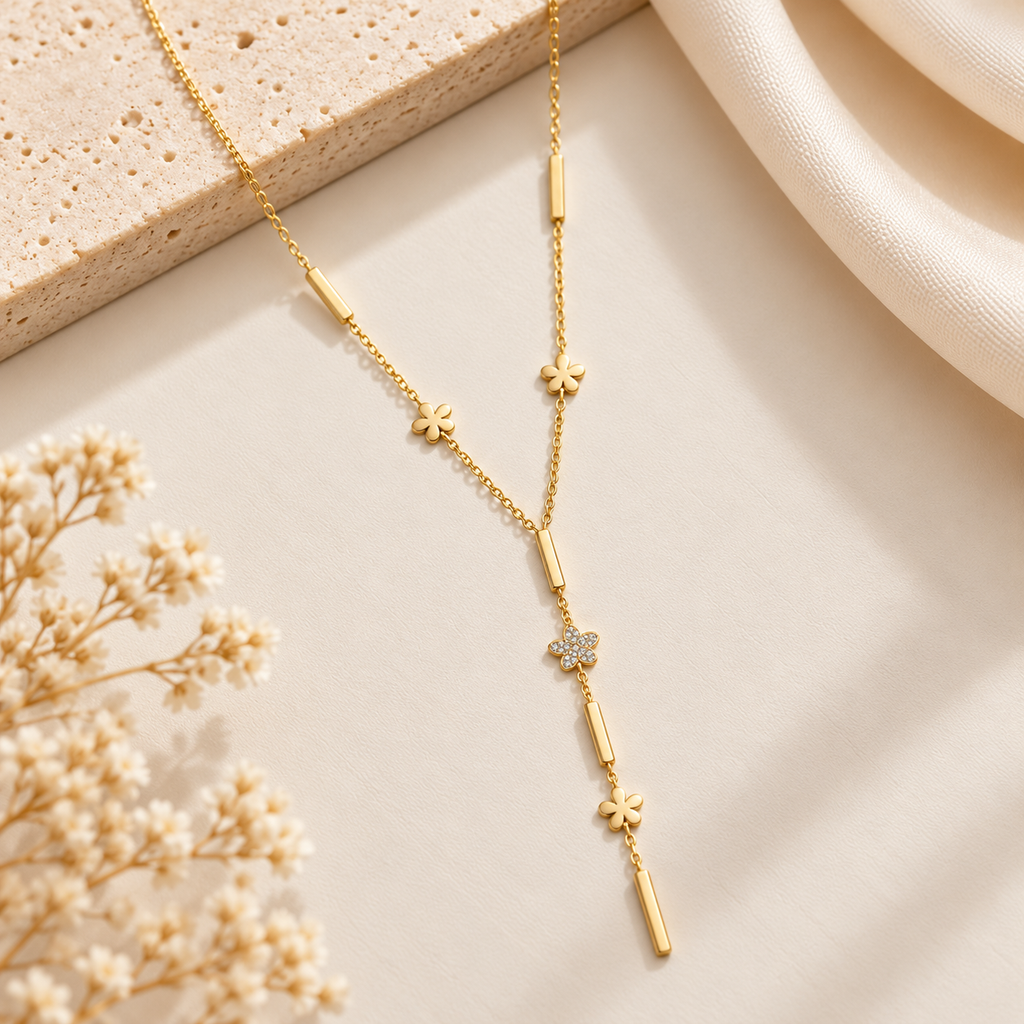  Gold Floral Y-Lariat Necklace on flat lay