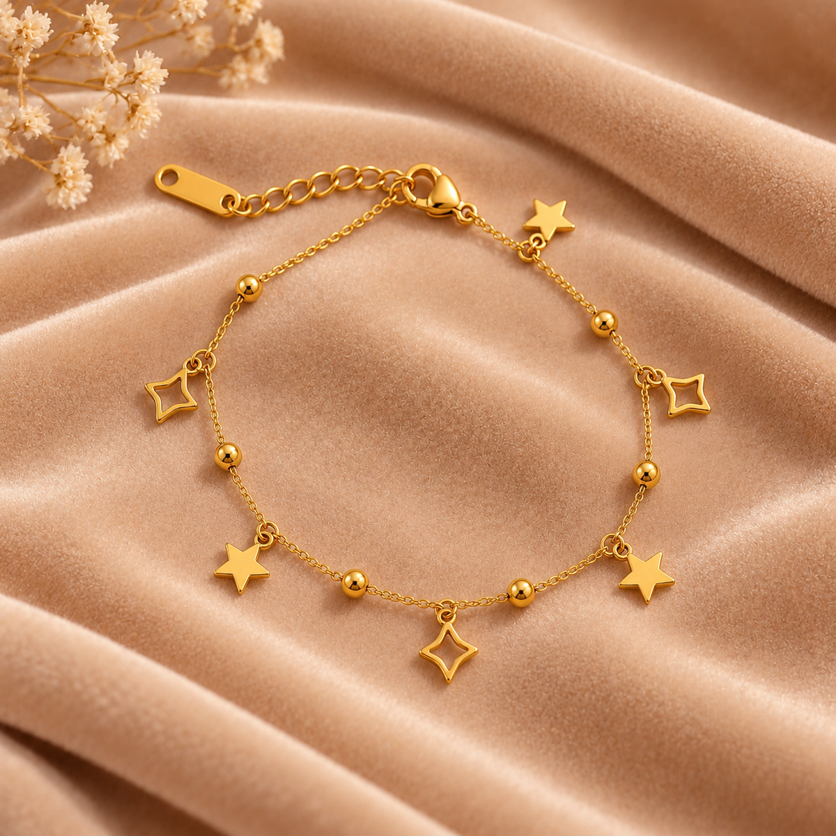 Gold Star and Geometric Charm Bracelet on velvet
