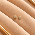 Pave Gold Cushion Stud Earrings on velvet
