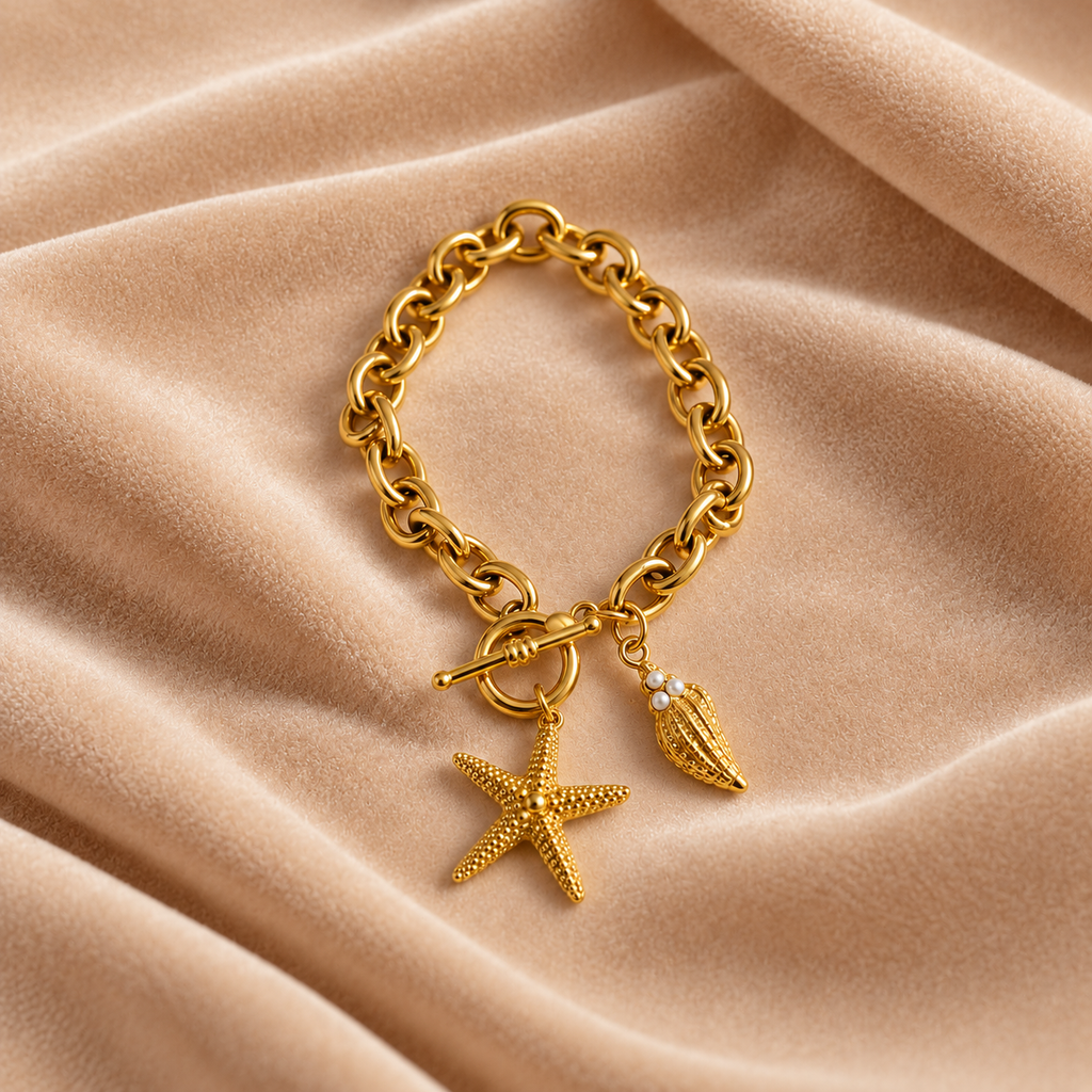 Gold-Tone Starfish & Seashell Charm Bracelet for Women on velvet