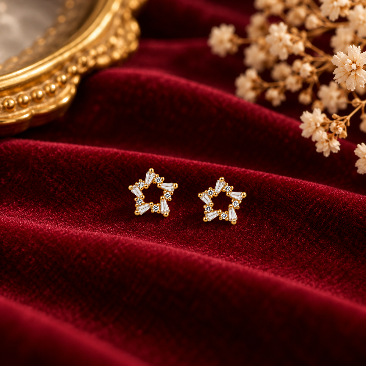 Delicate Gold Star Stud Earrings on velvet