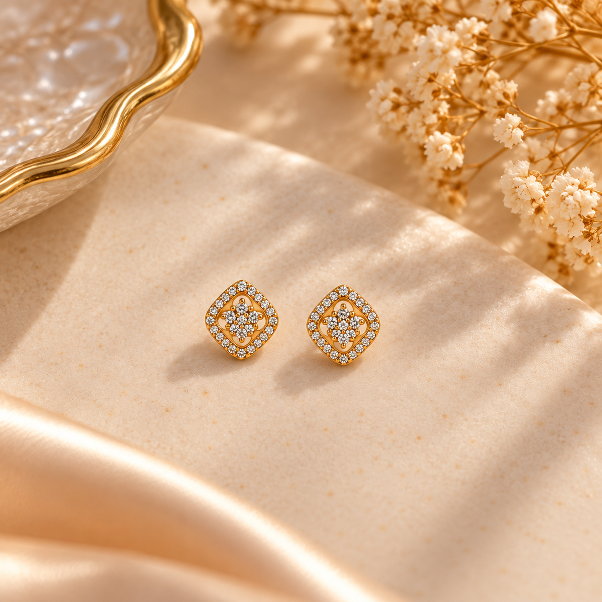 Elegant Gold Diamond Stud Earringson flat lay