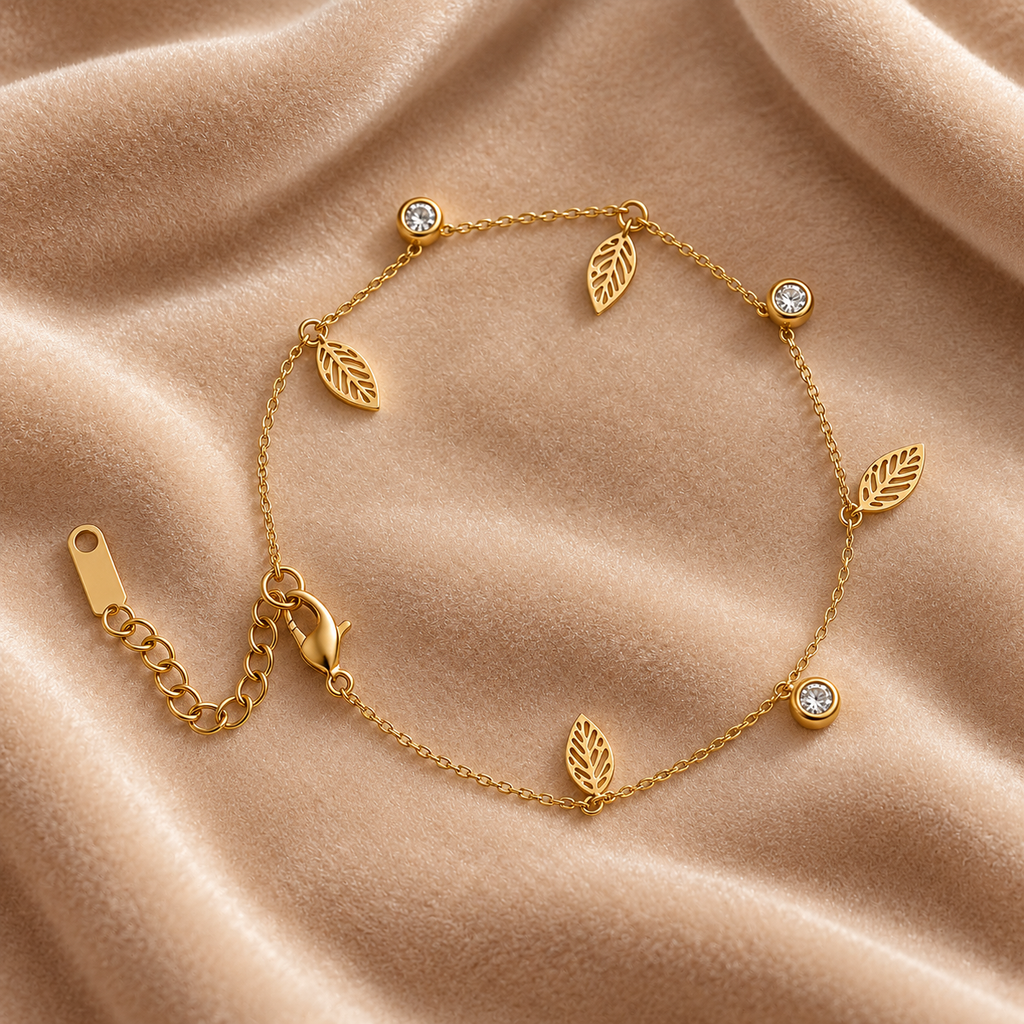 Gold Leaf Charm Bracelet with Crystal Accents on velvet