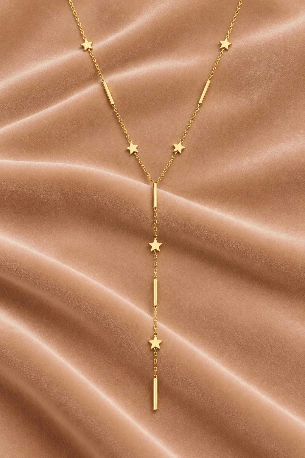 Gold Star Y-Lariat Necklace on velvet