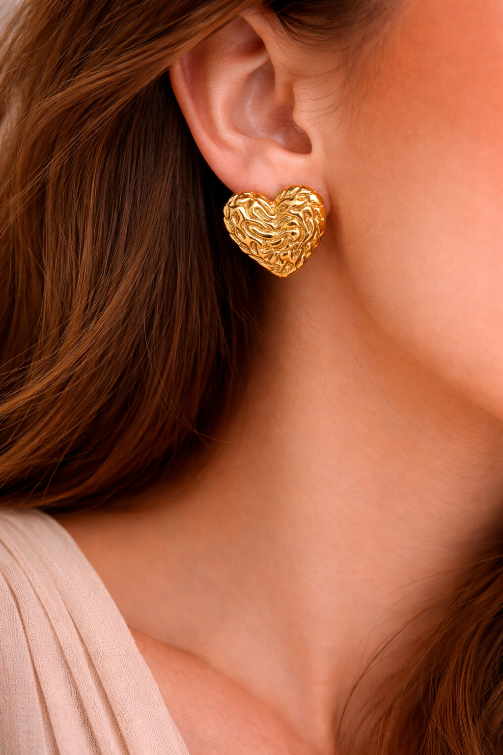Gold heart earring