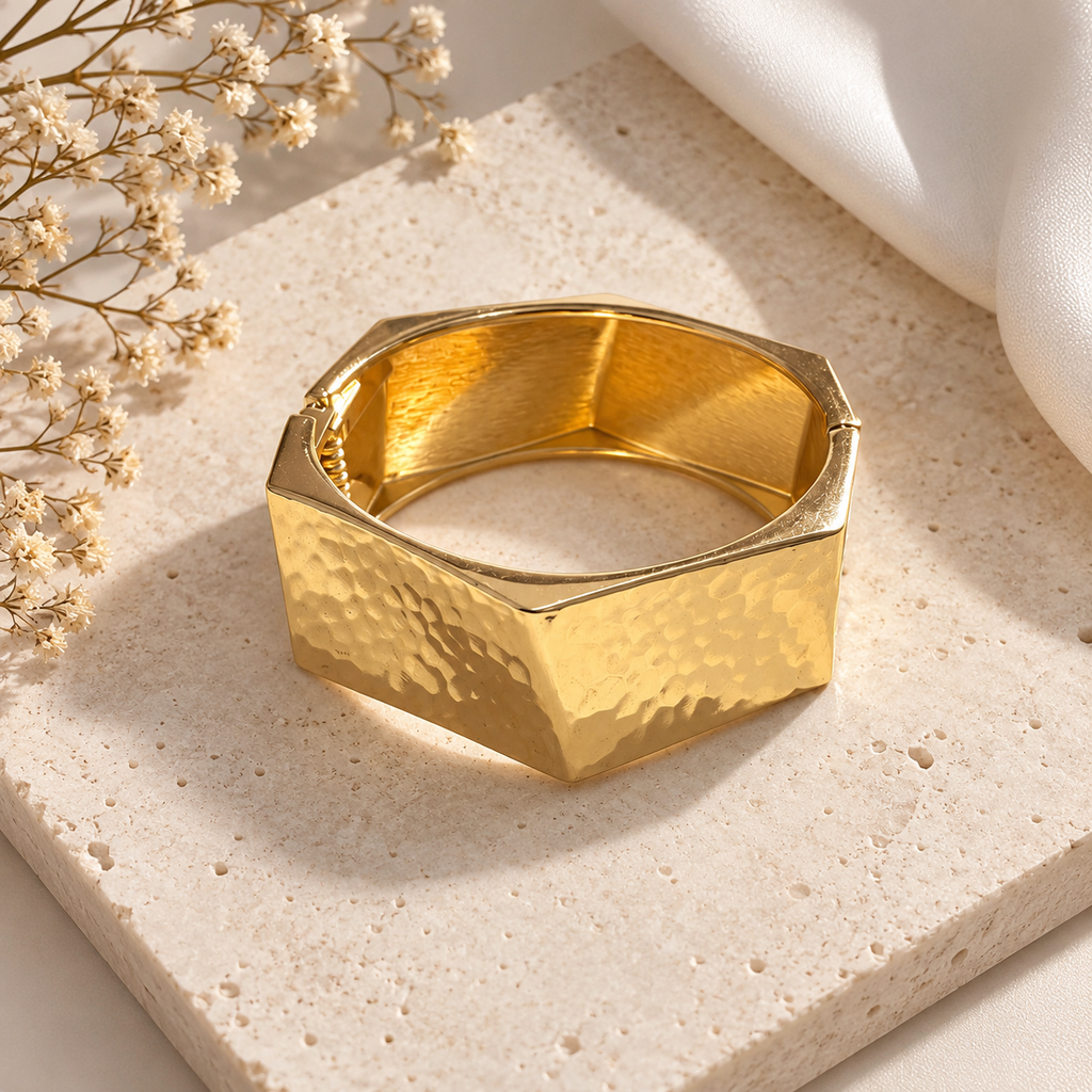 Hammered Gold Geometric Bangle on flat lay 