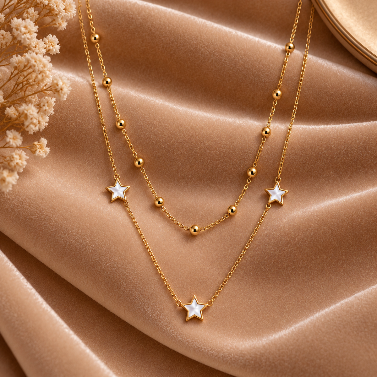 Layered Gold Star Necklace with Beaded Chain on velvet